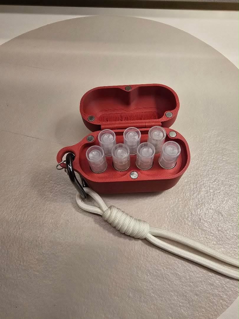 ScentPod rosso mattone aperto con sette campioncini